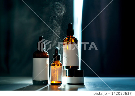 Skincare cosmetic products displayed with glowing light particles Skincare cosmetic products displayed with glowing light particles 142053637