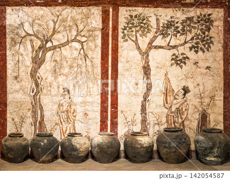 Ancient Chinese tomb frescoes, figures under tree panels from Tang dynasty GuoXing tomb exhibited in the Jinyang Ancient City Archaeological Museum, Taiyuan Shanxi China. Ancient Chinese tomb frescoes, figures under tree panels from Tang dynasty GuoXing tomb exhibited in the Jinyang Ancient City Archaeological Museum, Taiyuan Shanxi China. 142054587