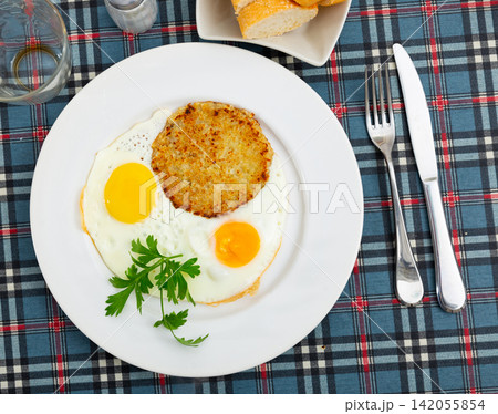 On plate are marrow squash pancakes with fried eggs On plate are marrow squash pancakes with fried eggs 142055854