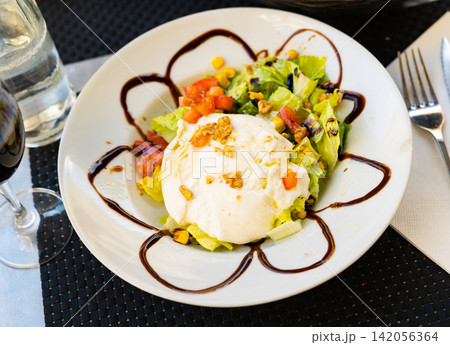 Burrata cheese with fresh vegetable salad Burrata cheese with fresh vegetable salad 142056364