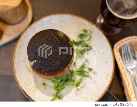 Hot mushroom cream soup of champignons and vegetables in tartlet made from rye flour 142056573