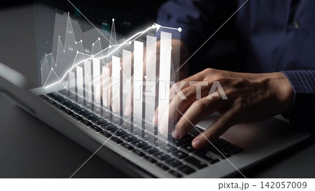 Business Professional Analyzing Data Trends on a Laptop with Graphs and Metrics Illustrating Growth and Performance Improvement Copula 142057009