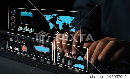 Hands typing on keyboard with digital screens showing analytics, graphs, and global maps in a dark environment emphasizing technology and data visualization Gluon Hands typing on keyboard with digital screens showing analytics, graphs, and global maps in a dark environment emphasizing technology and data visualization Gluon 142057043