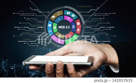 Futuristic Digital Interface with Hand Holding Smartphone Displaying Web 3.0 Elements and Icons in a Modern Urban Environment at Night. Entropy 142057635