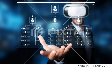 A businessman engages with virtual reality technology, manipulating digital graphs and data. This image represents the future of business strategy and innovative solutions. Sigmoid A businessman engages with virtual reality technology, manipulating digital graphs and data. This image represents the future of business strategy and innovative solutions. Sigmoid 142057730