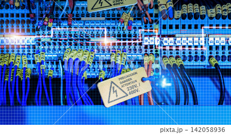 Electric wiring diagram of machinery in industrial factory. Terminal diagram with tag and warning label. High voltage electric wire. Automation machinery control panel. Electrical control cabinet. Electric wiring diagram of machinery in industrial factory. Terminal diagram with tag and warning label. High voltage electric wire. Automation machinery control panel. Electrical control cabinet. 142058936