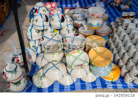 Group of ceramic Rooster bowls and dish selling in local market in Lampang province of Thailand. The Rooster Bowl a significant product of Lampang. Group of ceramic Rooster bowls and dish selling in local market in Lampang province of Thailand. The Rooster Bowl a significant product of Lampang. 142059118