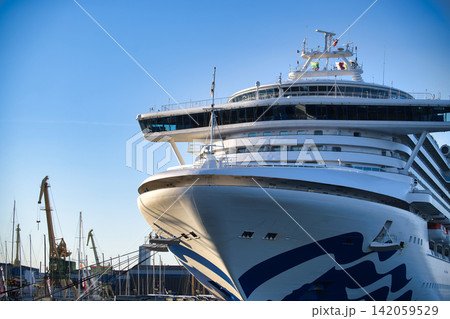 Large Cruise Ship Moored at Harbor Pier Large Cruise Ship Moored at Harbor Pier 142059529