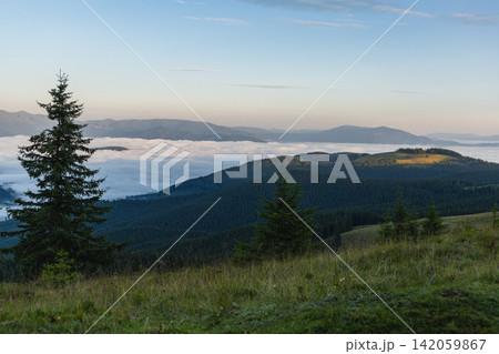 Views of Kukul in the Carpathians with mist over the valley Views of Kukul in the Carpathians with mist over the valley 142059867