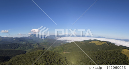Aerial view of Carpathian mountains in Ukraine with valleys and forests Aerial view of Carpathian mountains in Ukraine with valleys and forests 142060028