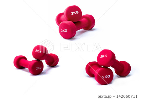 Set of red dumbbells isolated on white background. 3 pairs of red neoprene dumbbells. Home gym equipment for exercise at home. Weight training equipment. Small dumbbells for muscle strength building. Set of red dumbbells isolated on white background. 3 pairs of red neoprene dumbbells. Home gym equipment for exercise at home. Weight training equipment. Small dumbbells for muscle strength building. 142060711