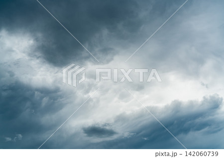 Dark dramatic sky and clouds. Background for death and sad concept. Halloween day background. Thunder and storm sky. Sad and moody sky. Nature background. Dead abstract background. Cloudscape. Dark dramatic sky and clouds. Background for death and sad concept. Halloween day background. Thunder and storm sky. Sad and moody sky. Nature background. Dead abstract background. Cloudscape. 142060739