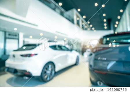 Blurred SUV car parked in modern showroom. Car dealership and auto leasing concept. Automotive industry. Modern luxury showroom. Rear view new car parked in showroom. Electric automobile technology. Blurred SUV car parked in modern showroom. Car dealership and auto leasing concept. Automotive industry. Modern luxury showroom. Rear view new car parked in showroom. Electric automobile technology. 142060756