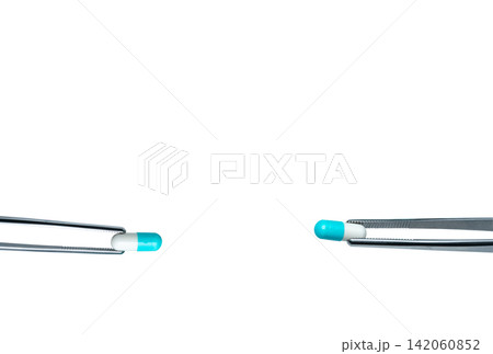 Two forceps pick white-blue capsule pills. Drugs choose for test in lab. Antibiotic drug selection. Antibiotic drug resistance concept. QA and QC in pharmaceutical factory concept. Drugs of choice. 142060852