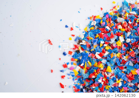 Plastic colorful pieces recycling shredded for industrial use. Plastic colorful pieces recycling shredded for industrial use. 142062130