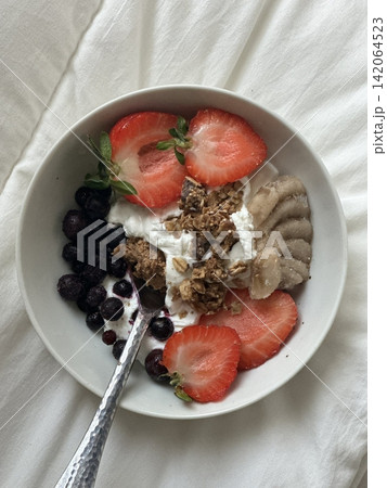 Creamy yogurt bowl topped with fresh fruits and crunchy toppings, offering a smooth texture and refreshing taste. Light, wholesome, and visually appealing, perfect for breakfast or healthy snack. Creamy yogurt bowl topped with fresh fruits and crunchy toppings, offering a smooth texture and refreshing taste. Light, wholesome, and visually appealing, perfect for breakfast or healthy snack. 142064523