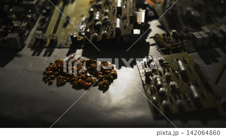 Arrangement Of Miniature Orange Elements On Electronic Board Under Warm Lighting Creating Repair Ambiance . Media 142064860