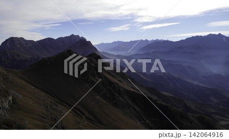 Panoramic rugged mountain range in clear daylight Panoramic rugged mountain range in clear daylight 142064916