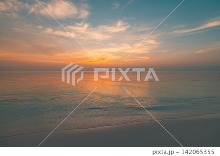 Tranquil pastel dusk soft clouds glowing over calm tropical sea warm reflected light horizon. Summer seascape wall art scenic. Coastal evening backdrop decor wallpaper Tranquil pastel dusk soft clouds glowing over calm tropical sea warm reflected light horizon. Summer seascape wall art scenic. Coastal evening backdrop decor wallpaper 142065355