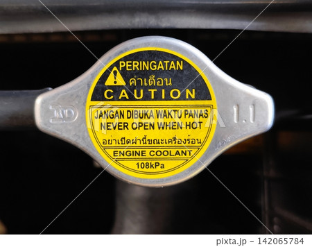 radiator water tank cap on a car. radiator water tank cap on a car. 142065784