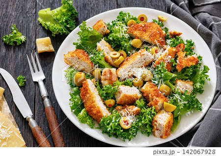 panko breaded fried meat, olives, cheese, lettuce panko breaded fried meat, olives, cheese, lettuce 142067928