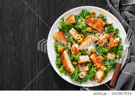 sliced fried pork cutlet, olives, cheese, lettuce sliced fried pork cutlet, olives, cheese, lettuce 142067934