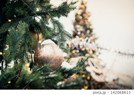 Details decorated Christmas tree with golden balls, garland. Outdoor. Xmas. Details decorated Christmas tree with golden balls, garland. Outdoor. Xmas. 142068613