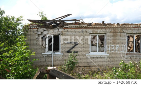 View to destroyed residential buildings at Kharkivska oblast. Ruined houses after bomb attacks on ukrainian territory from russia army. Consequences of russian invasion of Ukraine. Slow motion View to destroyed residential buildings at Kharkivska oblast. Ruined houses after bomb attacks on ukrainian territory from russia army. Consequences of russian invasion of Ukraine. Slow motion 142069710