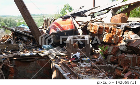 View to destroyed residential buildings at Kharkivska oblast. Ruined houses after bomb attacks on ukrainian territory from russia army. Consequences of russian invasion of Ukraine. Slow motion 142069711