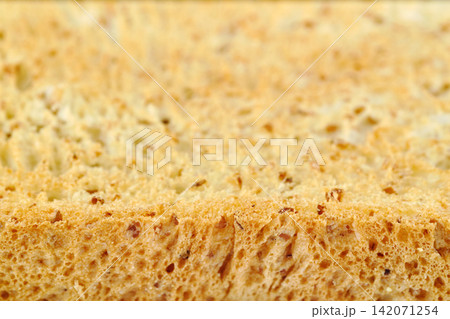 narrow focusing macro shot of the edge of a crunchy golden toasted sliced sliced whole sandwich bread for food wallpaper background narrow focusing macro shot of the edge of a crunchy golden toasted sliced sliced whole sandwich bread for food wallpaper background 142071254