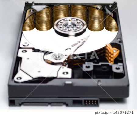 naked harddisk show internal disc with reflection of stacked gold coins  represent about e-business, blockchain and cryptocurrency on white background wish some shade and reflect 142071271
