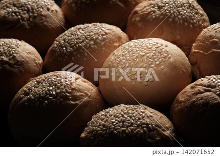 one perfect freshness sesame topping bun in spotlight among others berger breads on oven tray present about concept of picking up a chosen perfect one one perfect freshness sesame topping bun in spotlight among others berger breads on oven tray present about concept of picking up a chosen perfect one 142071652