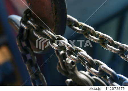 heavy metal chain and crane hook heavy metal chain and crane hook 142072375