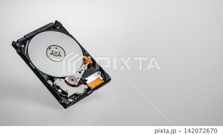a computer's hard disk hdd data storage drive without shield isolated in white background show magnetic disc and electronic part inside a computer's hard disk hdd data storage drive without shield isolated in white background show magnetic disc and electronic part inside 142072670