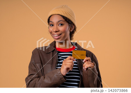 Successful Pretty Teenage Girl Showing An Unlimited Gold Credit Card Toward Camera, Confident Young 142073866
