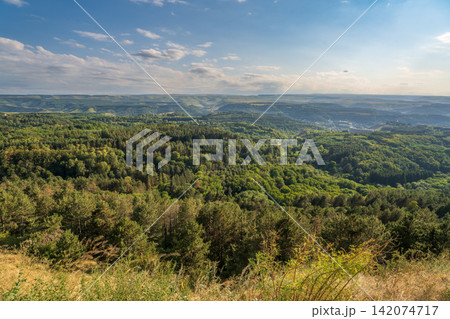 Layers of green mountains and hills in the haze during sunset. Panoramic View of Green hills and Meadow. Layers of green mountains and hills in the haze during sunset. Panoramic View of Green hills and Meadow. 142074717