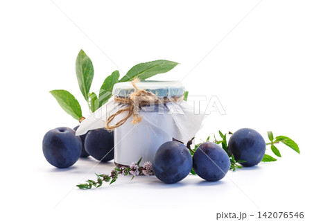 Homemade plum jam with ripe plums on clean white background Homemade plum jam with ripe plums on clean white background 142076546