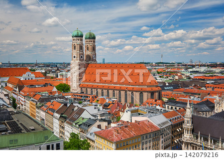 Munich city skyline with Frauenkirche cathedral and red roofs in Bavaria 142079216