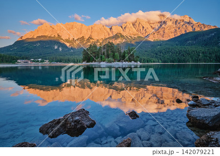 Eibsee Lake Sunset with Maximiliansinsel Island and Zugspitze Mountain Germany Eibsee Lake Sunset with Maximiliansinsel Island and Zugspitze Mountain Germany 142079221