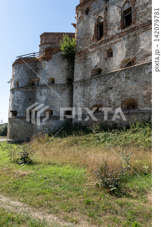 Ancient round bastion and ruined stone palace walls of Medzhybizh fortress Ancient round bastion and ruined stone palace walls of Medzhybizh fortress 142079781