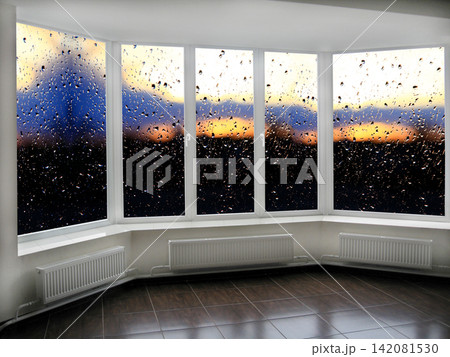 big office windows with sunset beyond it big office windows with sunset beyond it 142081530