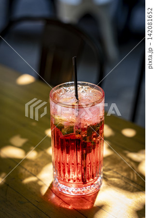 Red Cocktail with Ice in an Elegant Glass. Red Cocktail with Ice in an Elegant Glass. 142081652