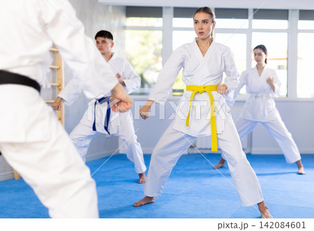 Group of people training karate technique Group of people training karate technique 142084601