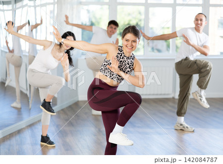 Team of dancers performing contemporary dance in choreography studio 142084787