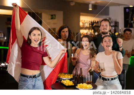 Group of fans in bar with Canadian flag 142084858