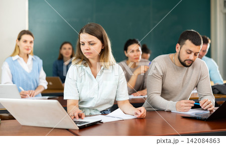 University students exercising in class room University students exercising in class room 142084863