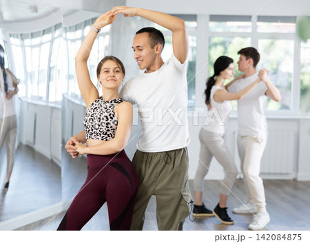 Couples of young men and women dancing waltz 142084875