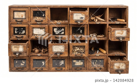 Vintage wooden hardware cabinet with multiple small drawers and labels hardware organizer compartments workshop fasteners collection furniture industrial weathered multiple isolated Vintage wooden hardware cabinet with multiple small drawers and labels hardware organizer compartments workshop fasteners collection furniture industrial weathered multiple isolated 142084928