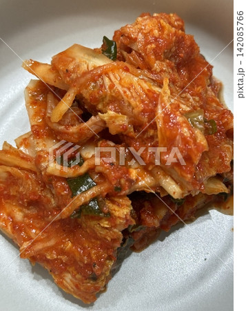 Traditional Korean kimchi, a spicy and tangy fermented cabbage dish with a blend of garlic, chili, and scallions. Known for its bold flavors and rich probiotic benefits. Traditional Korean kimchi, a spicy and tangy fermented cabbage dish with a blend of garlic, chili, and scallions. Known for its bold flavors and rich probiotic benefits. 142085766