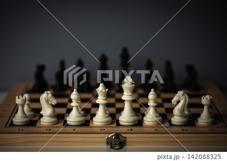 chess board with full set of white and black pieces 142088325